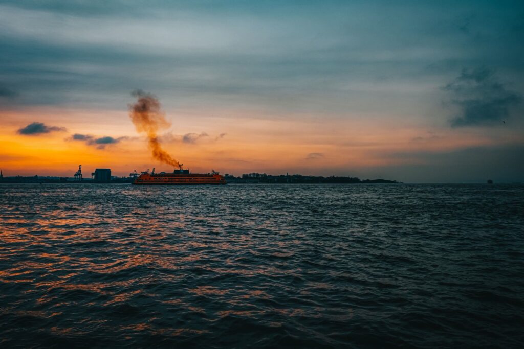 The Staten Island Ferry crossing New York Harbor at sunset