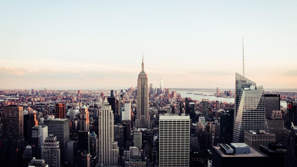 New York City skyline with Empire State Building at dusk, seen from Brooklyn