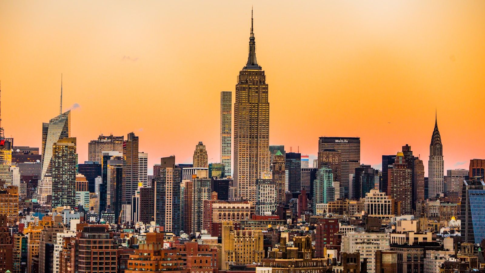 New York City skyline at sunset with the Empire State Building and Chrysler Building