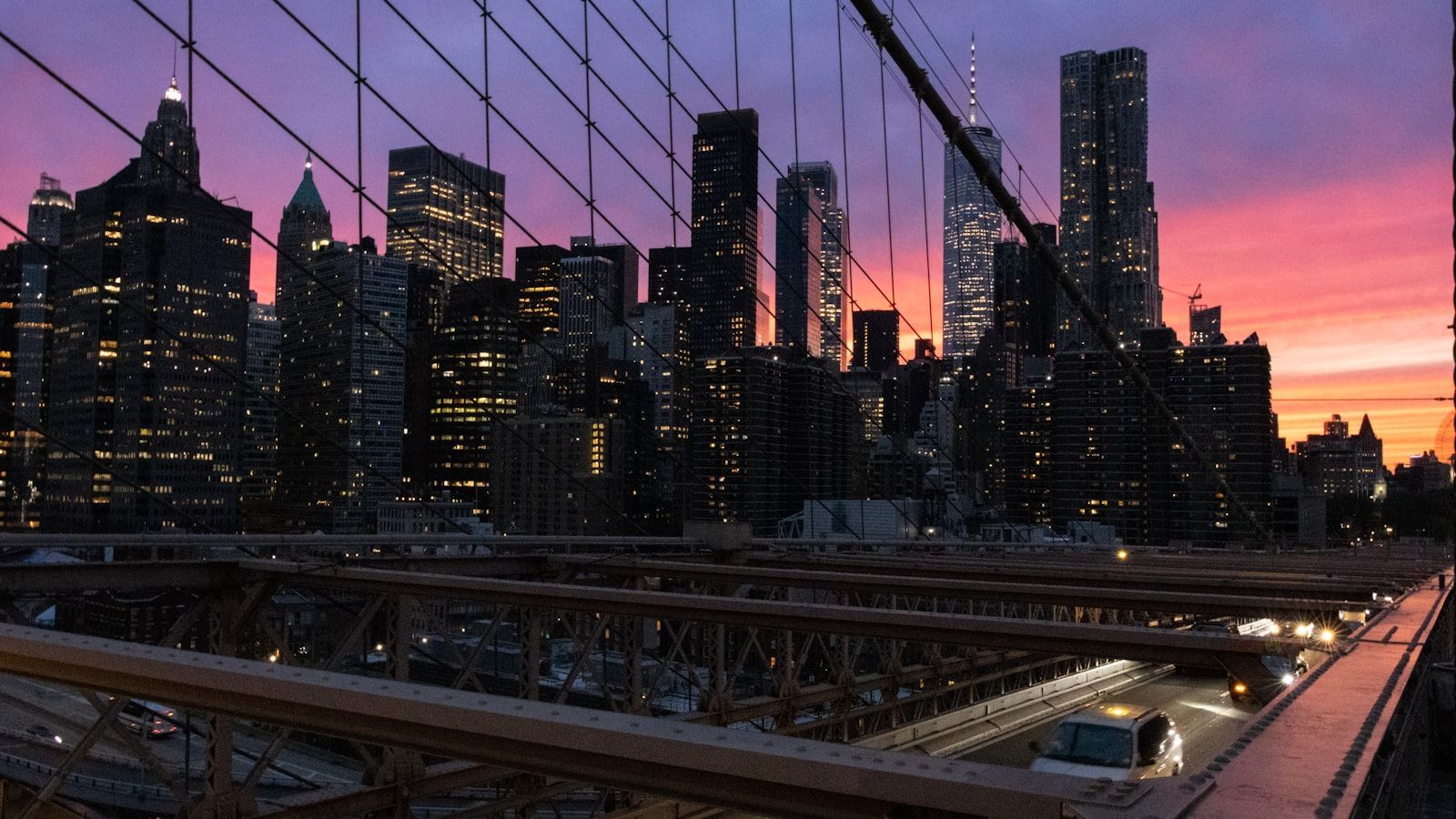 The Manhattan skyline viewed from the Brooklyn Bridge at dusk — the iconic waterfront perspective from DUMBO, Brooklyn