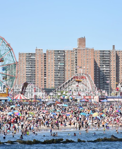 Coney Island beach and amusement park rides in Brooklyn, New York — a classic summer destination for families
