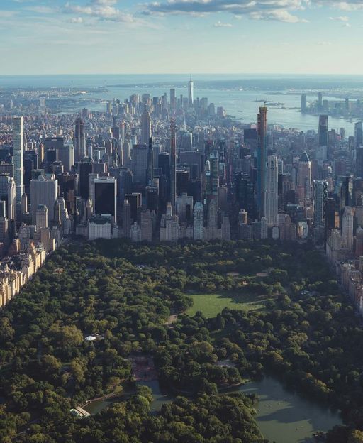 Aerial view of Central Park stretching through Midtown Manhattan with skyscrapers rising on all sides
