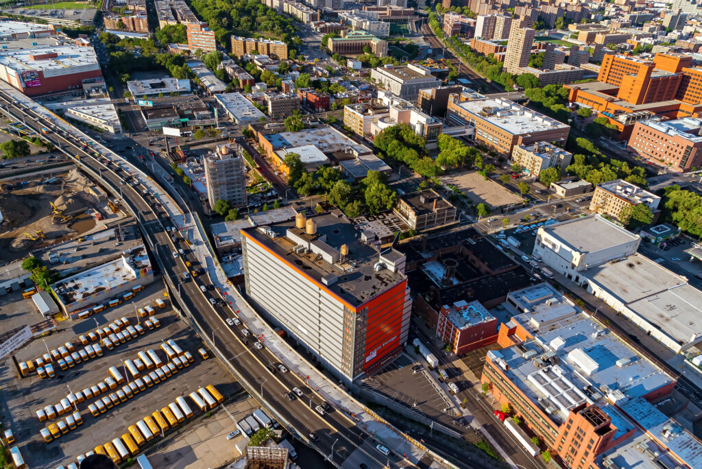 Aerial view over the South Bronx: an elevated expressway, warehouses and apartment blocks