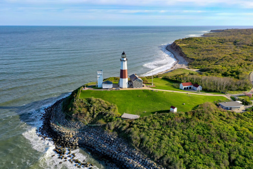 Montauk Point Lighthouse on its green headland at the eastern tip of Long Island, seen from above