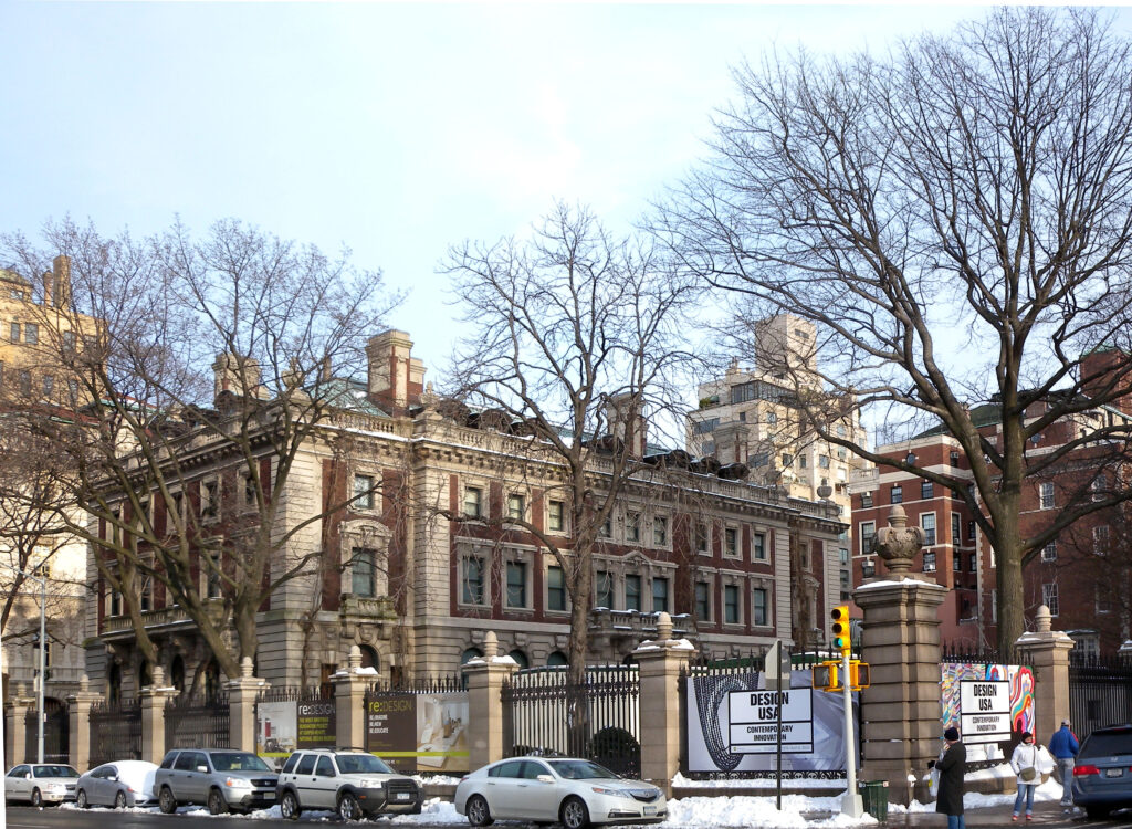 The red-brick and limestone Carnegie Mansion, home of Cooper Hewitt, behind its iron fence at Fifth Avenue and 90th Street after a snowfall
