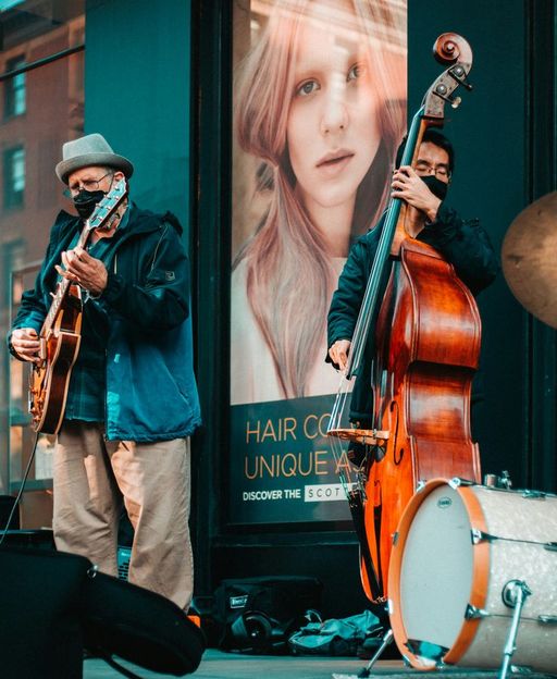 Jazz musicians performing on a vibrant New York City street, capturing the live music culture of NYC