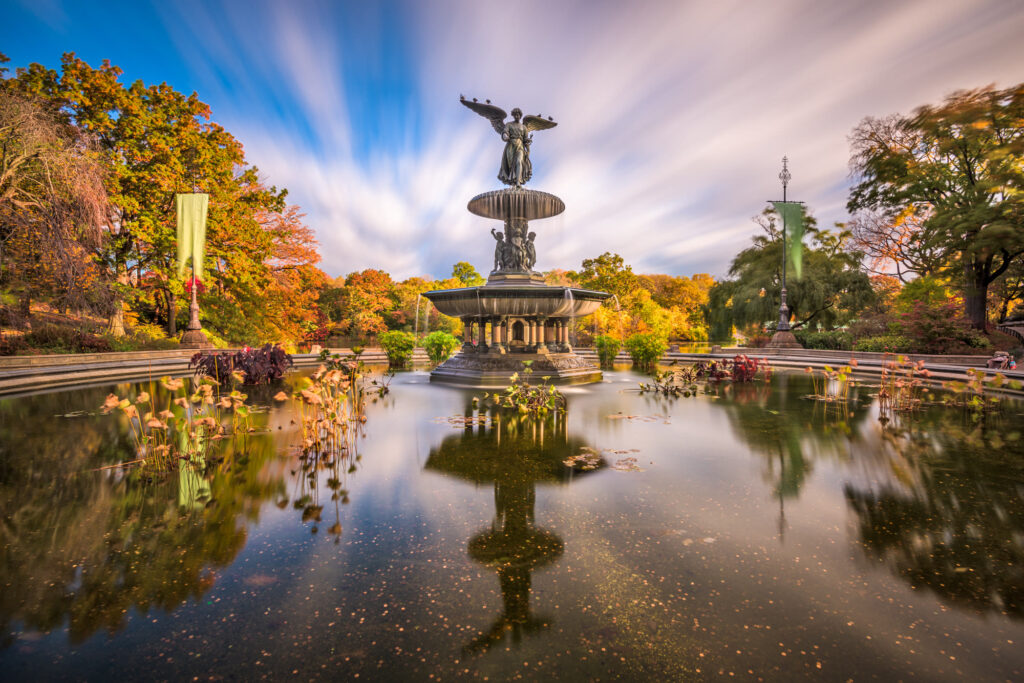 Bethesda Fountain and its Angel of the Waters statue in Central Park, ringed by autumn trees