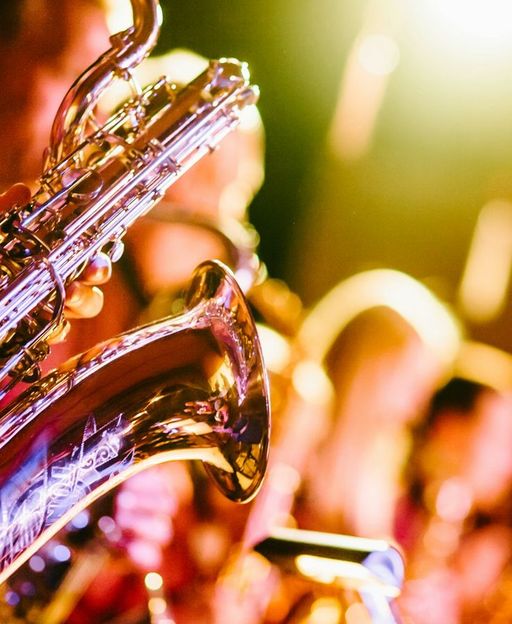Saxophones under stage lighting at a live jazz club in New York City