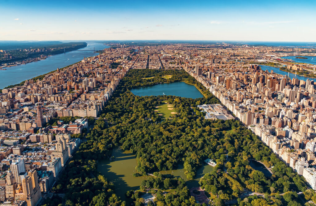 Aerial view looking north over Central Park, with the Upper West Side on the left, the Upper East Side on the right and the Hudson River beyond