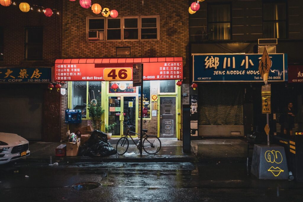 Mott Street in Chinatown, New York City, with lanterns and lit signs at night