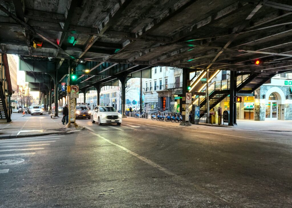 31st Street at Broadway in Astoria, Queens, under the elevated subway line