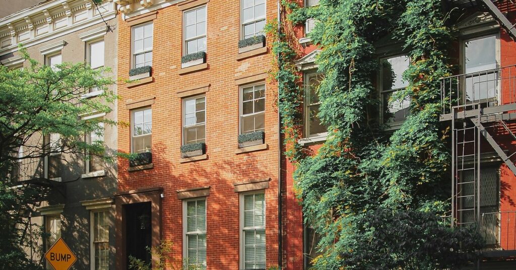 Classic brownstone buildings line a residential street in the Woodlawn neighbourhood of the Bronx, New York — home to one of the city's most enduring Irish immigrant communities.