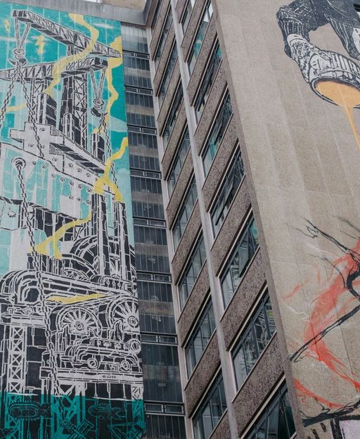 Large-scale street art murals covering building walls in Bushwick, Brooklyn, New York City