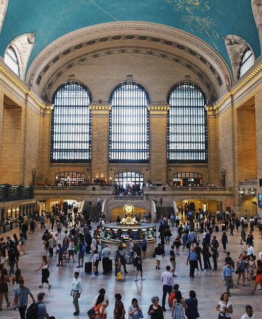 Grand Central Terminal main concourse with arched windows, celestial ceiling and the famous four-faced opal clock, New York City