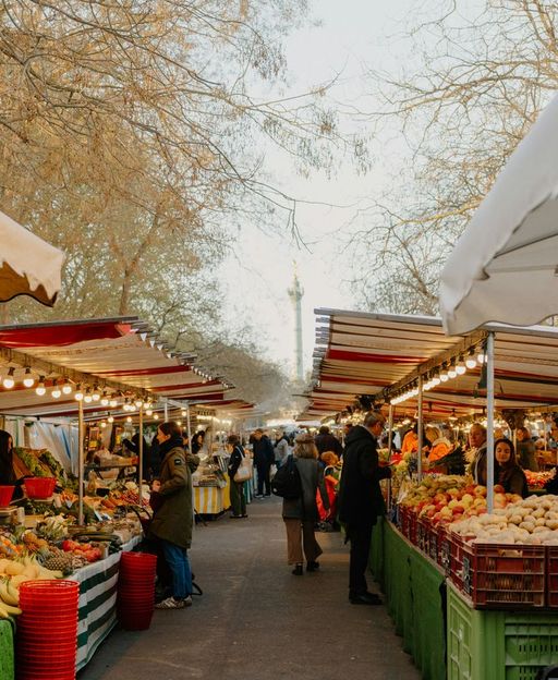 Outdoor autumn market stalls with fresh produce and canopies — a seasonal New York City tradition