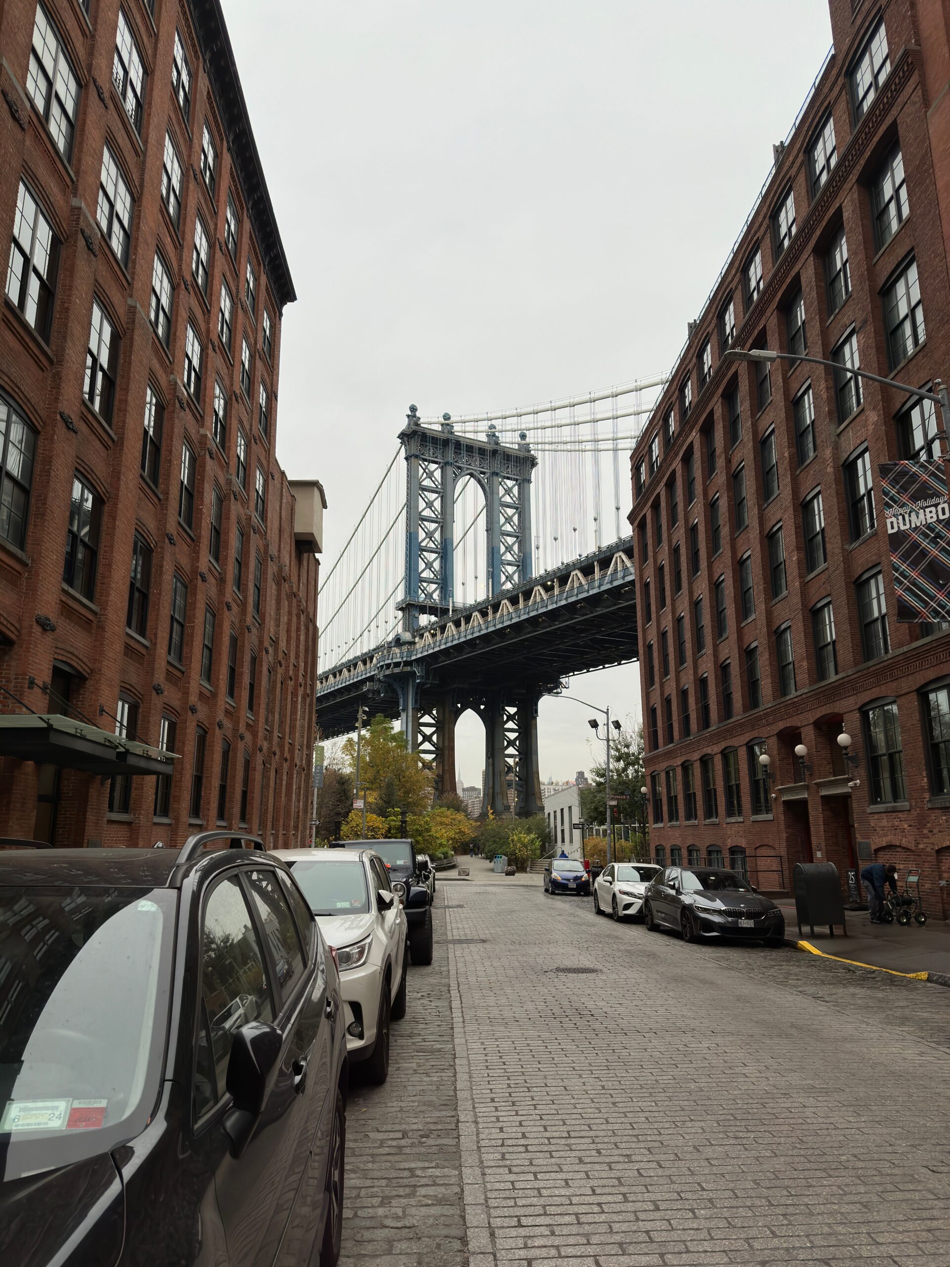 Manhattan Bridge framed by a cobblestone Dumbo street in Brooklyn