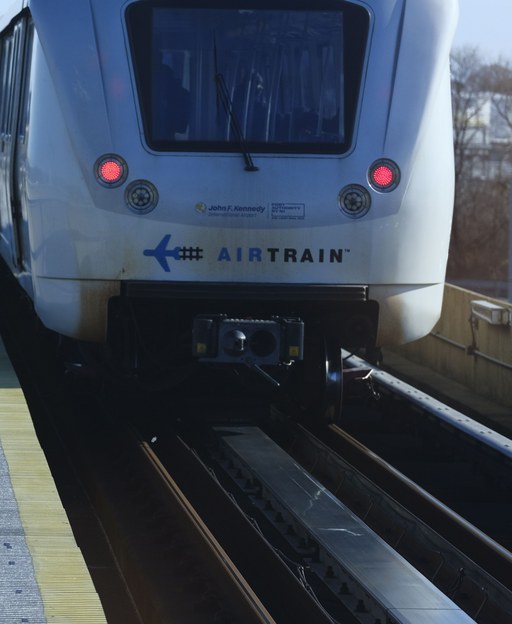 An AirTrain car arriving at a JFK Airport platform in Queens, New York