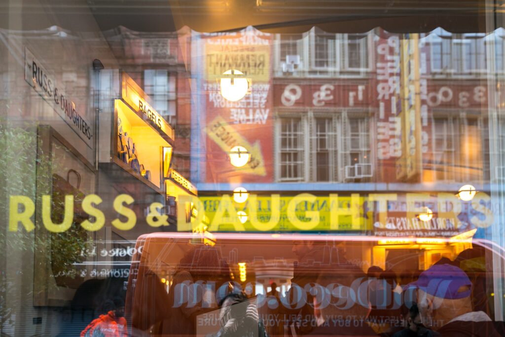 Russ & Daughters Cafe window with street reflections