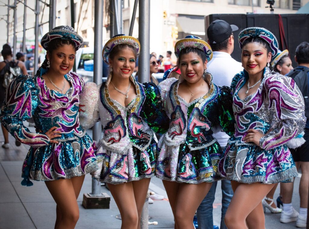 Dancers in sequined costumes at a street parade in New York