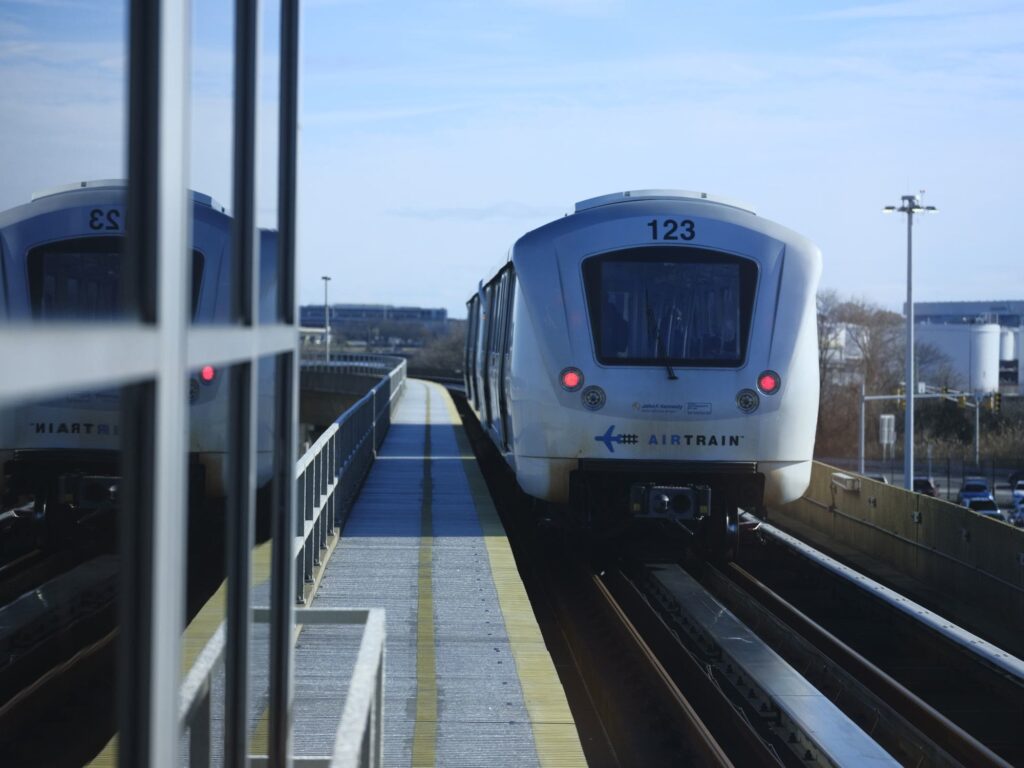 AirTrain JFK train approaching an airport station