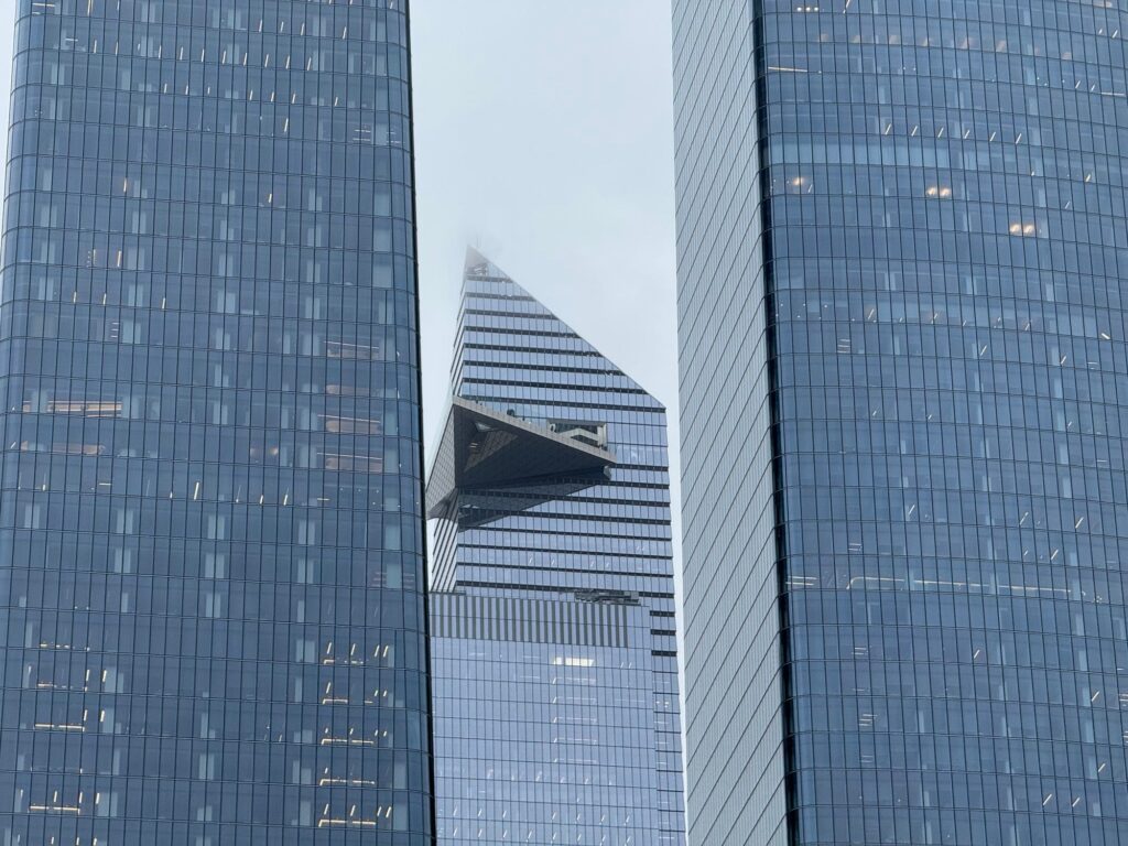 The triangular Edge sky deck jutting out from 30 Hudson Yards, framed between two glass towers