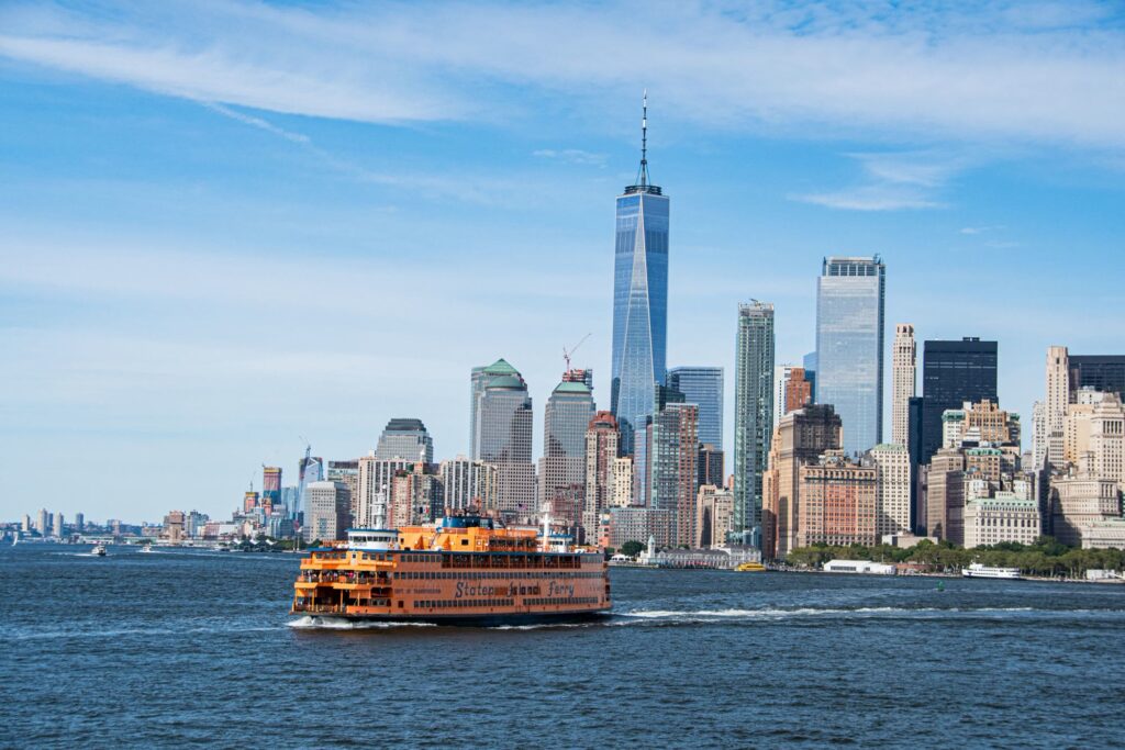Staten Island Ferry crossing the harbor with the Lower Manhattan skyline behind